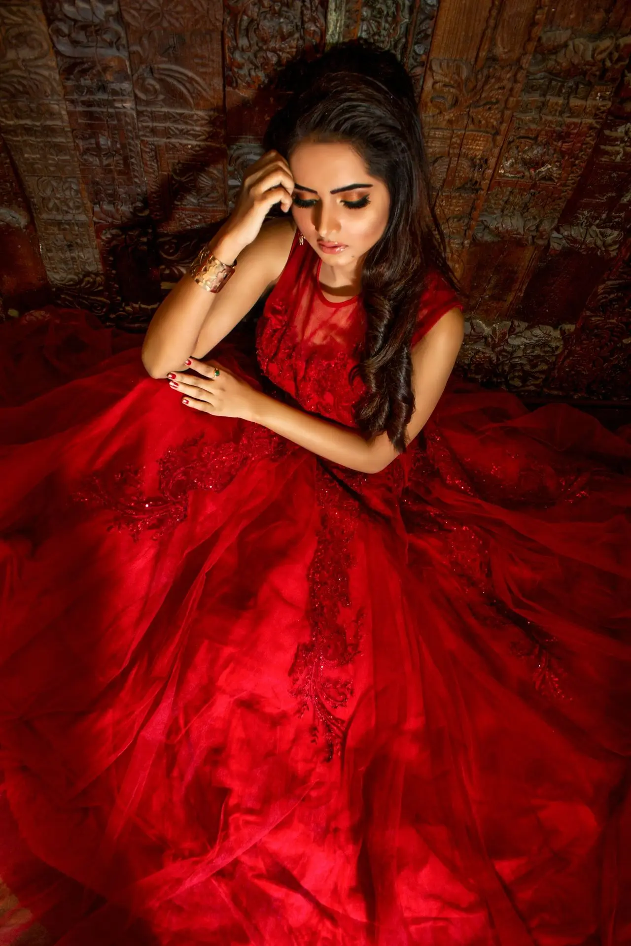woman in red dress sitting on chair